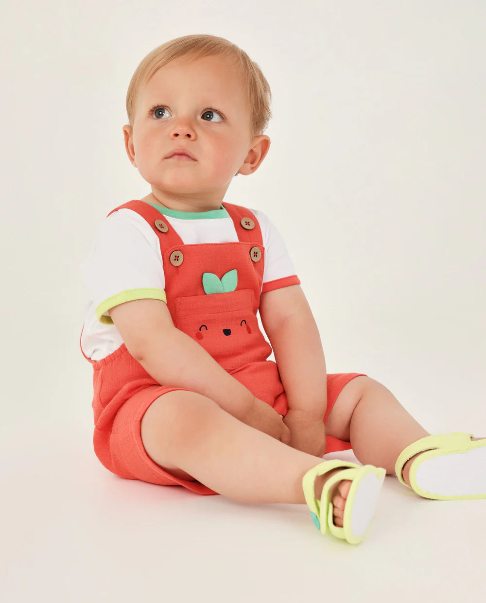 Completo in maglia per neonato con tasca frontale a forma di frutta